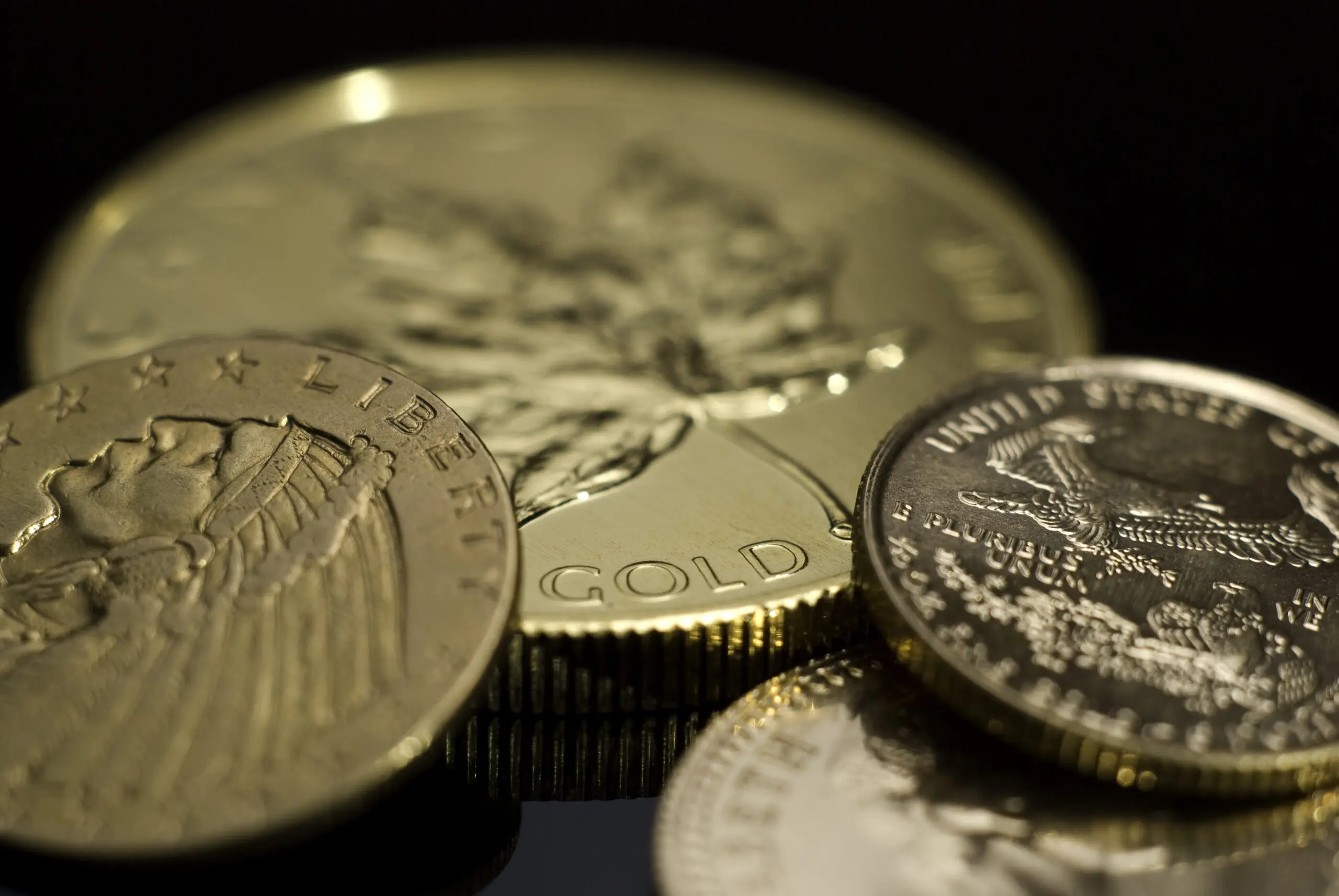 A close up of some gold coins on top of each other