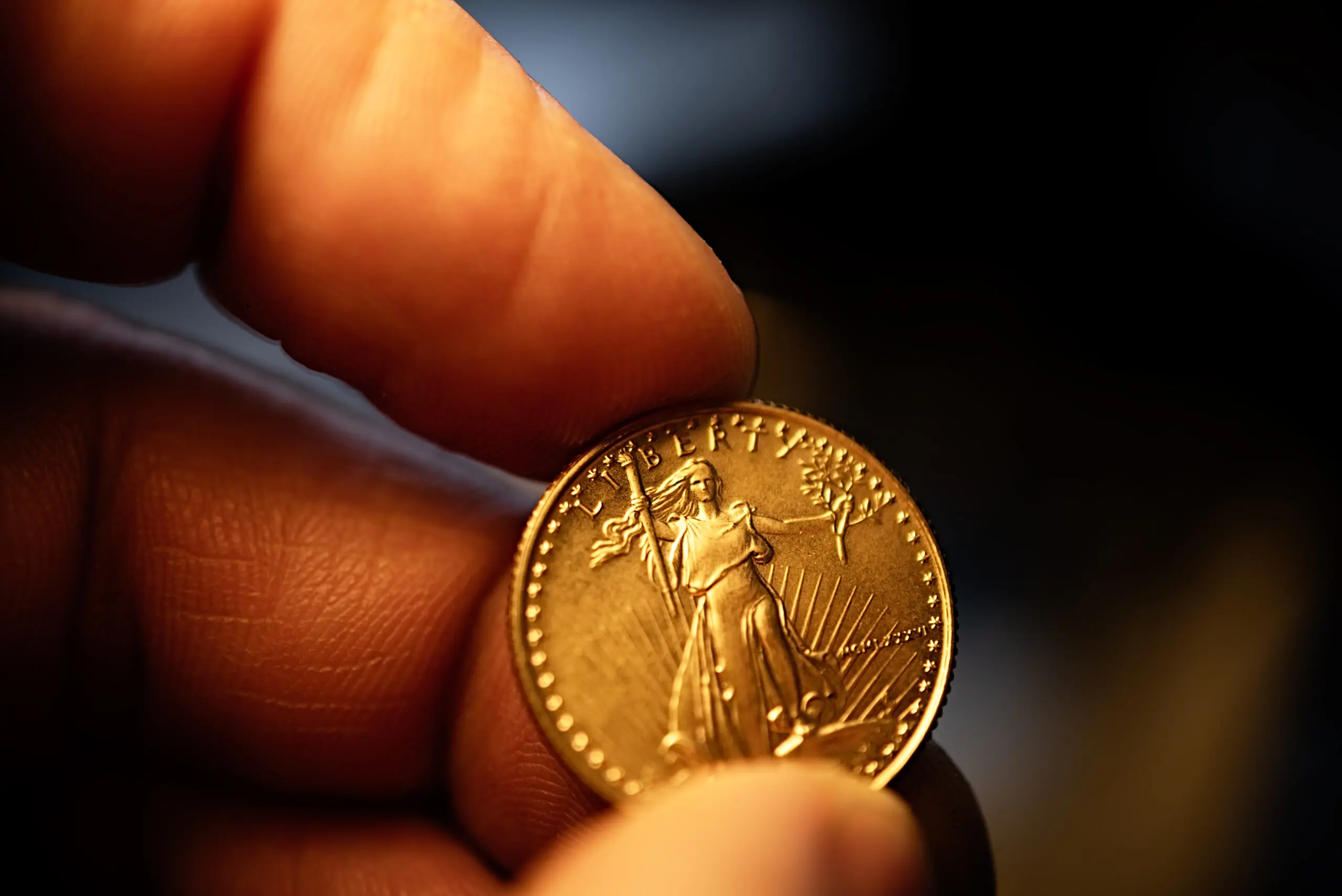A person holding a coin in their hand.