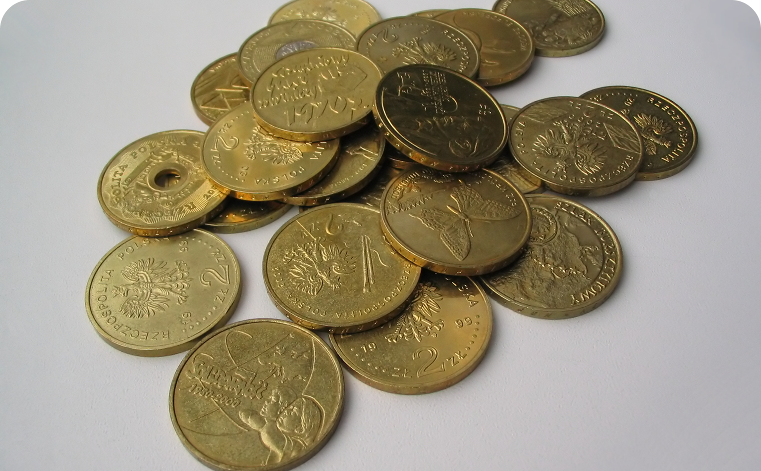 A pile of gold coins on top of each other.