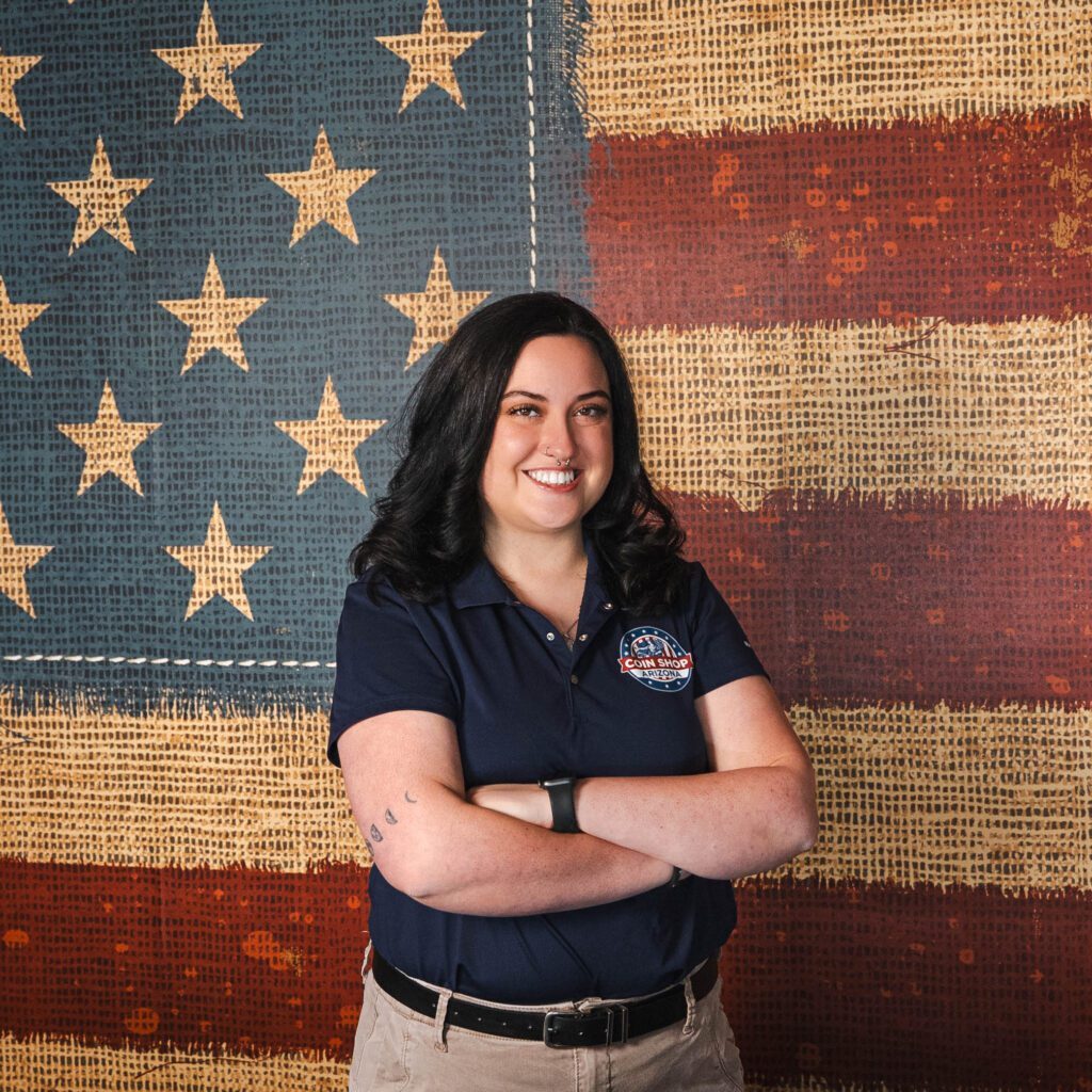 Person posing in front of American flag.