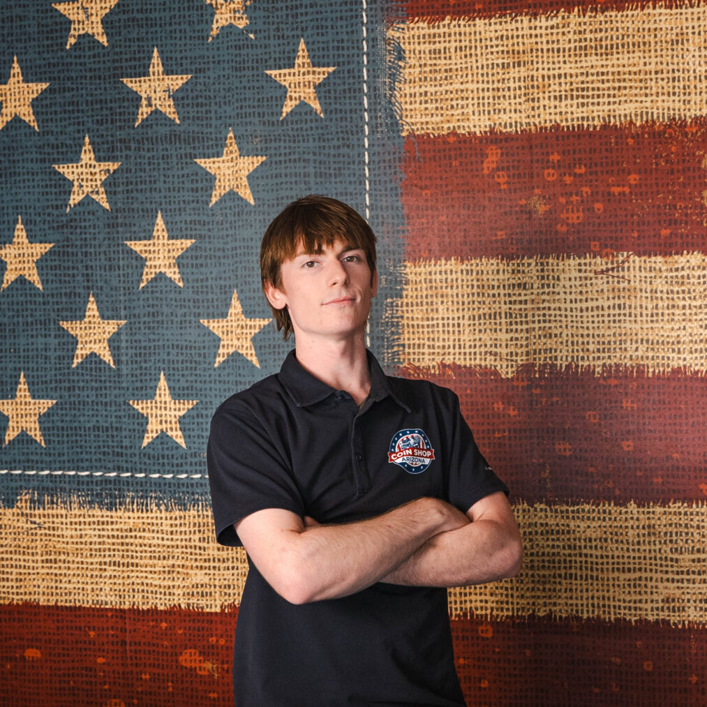 Man in Coin Shop Arizona polo, flag backdrop