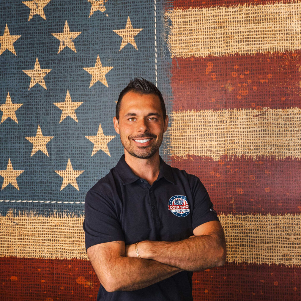 Bearded man in logo polo before textured flag
